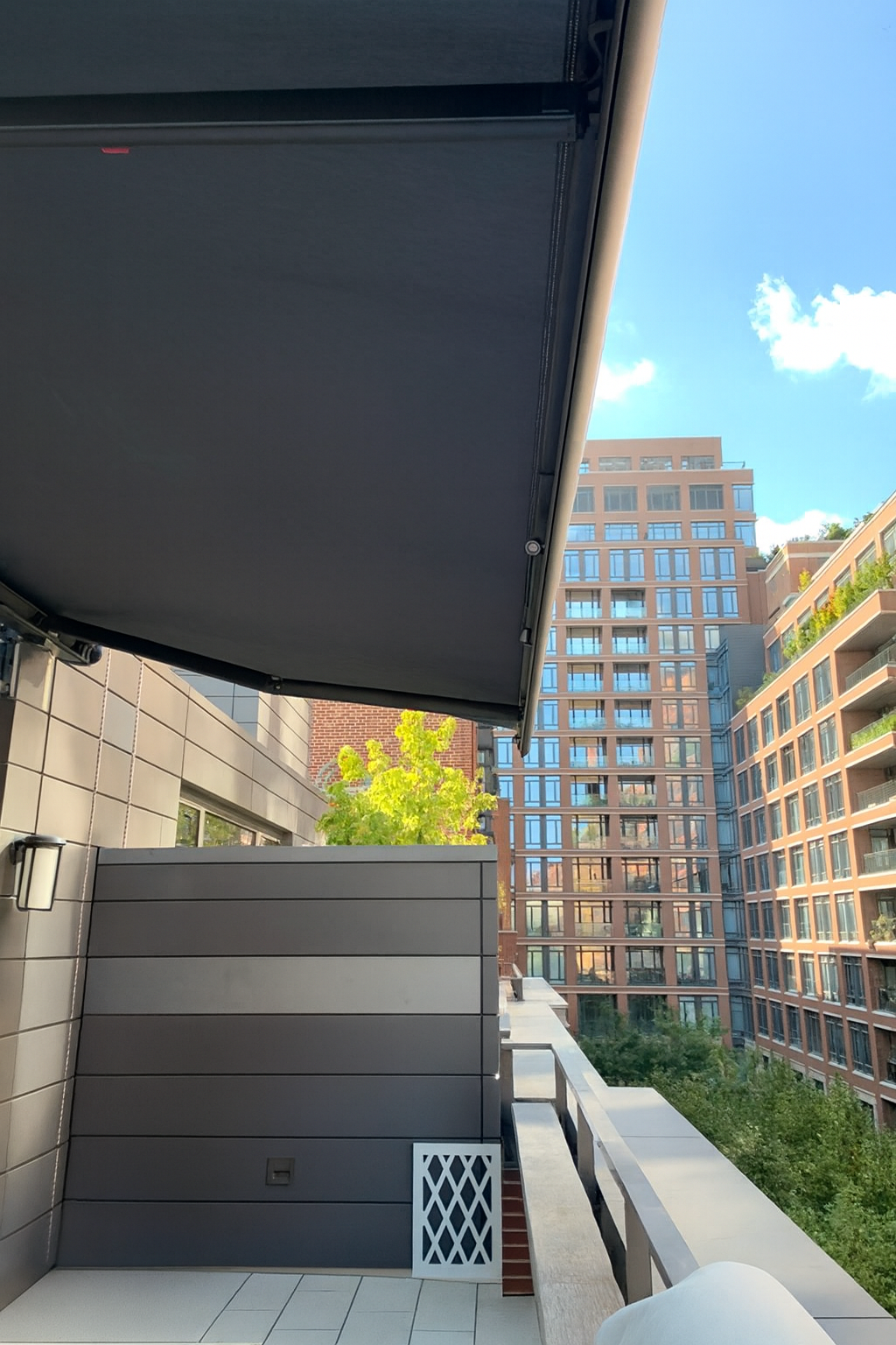 urban balcony with retractable awning